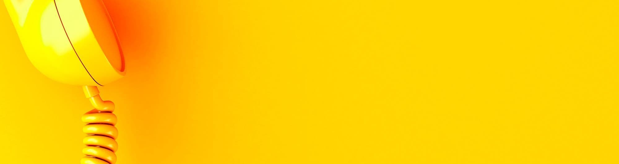 telefone de fio amarelo em fundo amarelo 
