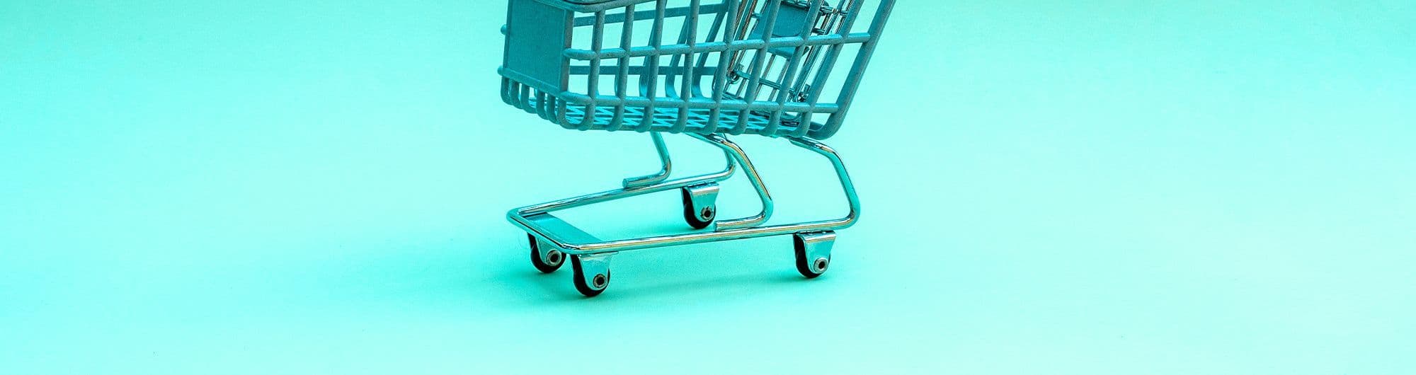 figura de carrinho de compras azul em com fundo de mesma cor
